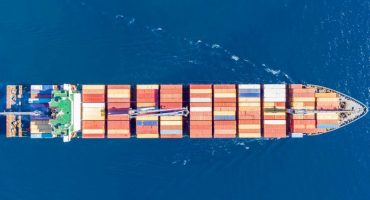 cargo-ship-full-loaded-with-containers-blue-sea-ba-DJZ24K3-scaled-e1621508795941